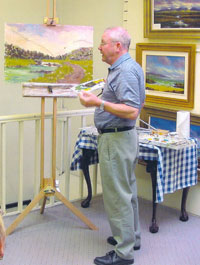 Picture of the Artist giving painting demonstration