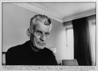 Samuel Beckett seated in Room 604,